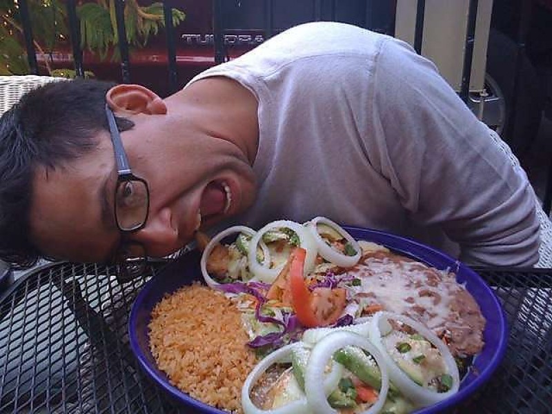 Customer Figuring Our How To Eat Los Patios Food